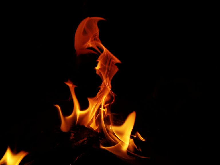 Vibrant flames dancing in the dark, showcasing the natural beauty of fire.